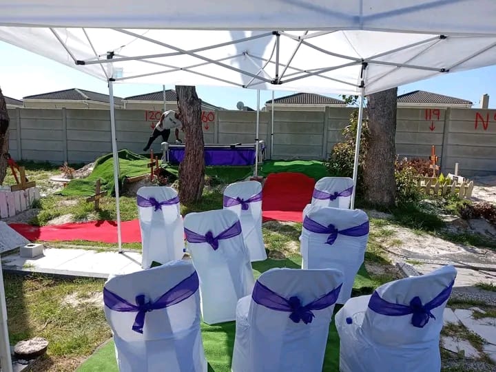 Professional Graveside Service Setup with Purple Sashes